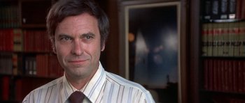 Movie still from “The Man Who Fell to Earth” (1976), directed by Nicolas Roeg – A person wearing a shirt and a tie; Close Up shot, Low angle