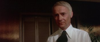 Movie still from “The Man Who Fell to Earth” (1976), directed by Nicolas Roeg – A person wearing a shirt and a tie; Close Up shot, Low angle