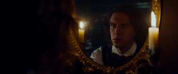Movie still from “The Man Who Invented Christmas” (2017), directed by Bharat Nalluri – A man looking at himself in a mirror; Close Up shot, Over the shoulder angle