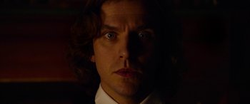 Movie still from “The Man Who Invented Christmas” (2017), directed by Bharat Nalluri – A person wearing a suit and tie; Close Up shot, Low angle