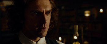 Movie still from “The Man Who Invented Christmas” (2017), directed by Bharat Nalluri – A person with long hair; Close Up shot, Over the shoulder angle