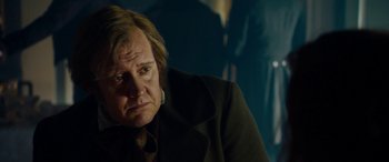 Movie still from “The Man Who Invented Christmas” (2017), directed by Bharat Nalluri – An older man wearing a coat and a black jacket; Close Up shot, Over the shoulder angle