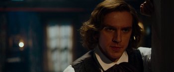 Movie still from “The Man Who Invented Christmas” (2017), directed by Bharat Nalluri – A person with long hair; Close Up shot, Over the shoulder angle