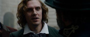 Movie still from “The Man Who Invented Christmas” (2017), directed by Bharat Nalluri – A person talking to another person; Close Up shot, Over the shoulder angle