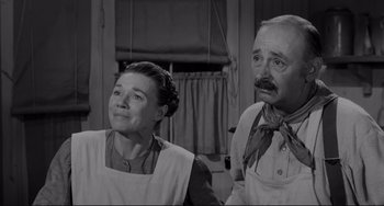 Movie still from “The Man Who Shot Liberty Valance” (1962), directed by John Ford – A man and a woman standing next to each other; Medium shot, Low angle