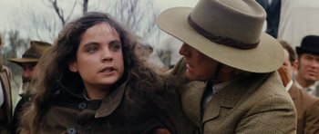 Movie still from “The Man from Snowy River” (1982), directed by George Miller – A woman and a man are looking at one another; Close Up shot, Over the shoulder angle