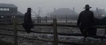 Movie still from “The Man from Snowy River” (1982), directed by George Miller – A person riding a horse through a field; Wide shot, Low angle