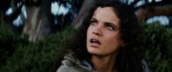 Movie still from “The Man from Snowy River” (1982), directed by George Miller – A person with long curly hair; Close Up shot, Low angle