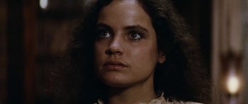 Movie still from “The Man from Snowy River” (1982), directed by George Miller – A person looking at the camera; Close Up shot, Low angle