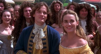 Movie still from “The Man in the Iron Mask” (1998), directed by Randall Wallace – A man and a woman dressed in period costumes; Medium shot, High angle