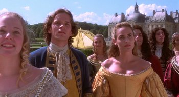 Movie still from “The Man in the Iron Mask” (1998), directed by Randall Wallace – A man and a woman dressed in period clothing; Medium shot, Low angle