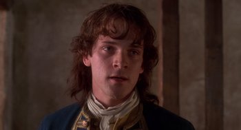 Movie still from “The Man in the Iron Mask” (1998), directed by Randall Wallace – A person with long hair; Close Up shot, Over the shoulder angle
