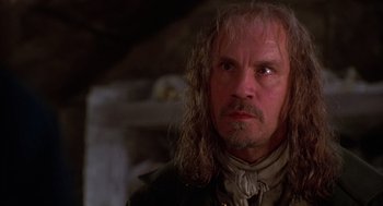 Movie still from “The Man in the Iron Mask” (1998), directed by Randall Wallace – A person with long hair; Close Up shot, Low angle