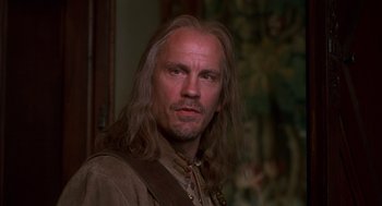 Movie still from “The Man in the Iron Mask” (1998), directed by Randall Wallace – A person with long hair; Close Up shot, Low angle
