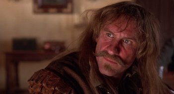 Movie still from “The Man in the Iron Mask” (1998), directed by Randall Wallace – A person with long hair; Close Up shot, Low angle