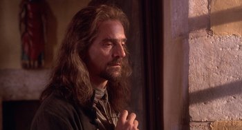 Movie still from “The Man in the Iron Mask” (1998), directed by Randall Wallace – A man with long hair and a long beard; Close Up shot, Low angle
