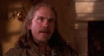 Movie still from “The Man in the Iron Mask” (1998), directed by Randall Wallace – A person with long hair; Close Up shot, Low angle