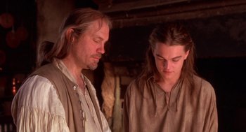 Movie still from “The Man in the Iron Mask” (1998), directed by Randall Wallace – A man and a young man standing next to each other; Close Up shot, Over the shoulder angle