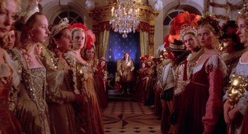 Movie still from “The Man in the Iron Mask” (1998), directed by Randall Wallace – A group of people dressed up in fancy costumes; Wide shot, Low angle