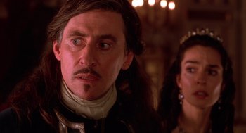 Movie still from “The Man in the Iron Mask” (1998), directed by Randall Wallace – A person wearing a costume; Close Up shot, Over the shoulder angle