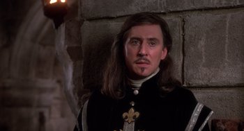 Movie still from “The Man in the Iron Mask” (1998), directed by Randall Wallace – A person wearing a suit and tie; Close Up shot, Low angle