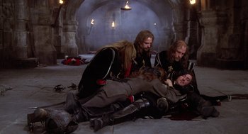 Movie still from “The Man in the Iron Mask” (1998), directed by Randall Wallace – A group of men standing next to each other on the ground; Wide shot, High angle