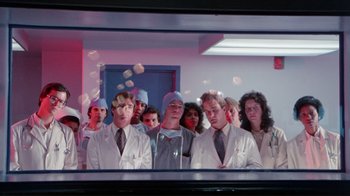 Movie still from “The Man with Two Brains” (1983), directed by Carl Reiner – A group of doctors standing next to each other in front of a mirror; Wide shot, Low angle