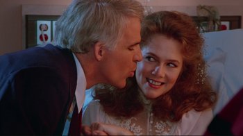 Movie still from “The Man with Two Brains” (1983), directed by Carl Reiner – A man and a woman are kissing each other; Close Up shot, Over the shoulder angle