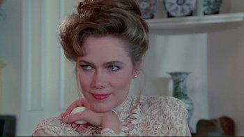 Movie still from “The Man with Two Brains” (1983), directed by Carl Reiner – A woman holding an egg in her hand; Close Up shot, Over the shoulder angle