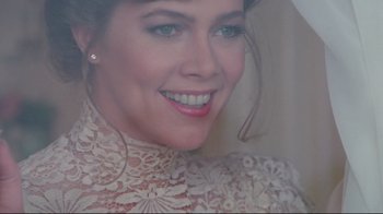 Movie still from “The Man with Two Brains” (1983), directed by Carl Reiner – A person wearing a dress; Close Up shot, Over the shoulder angle