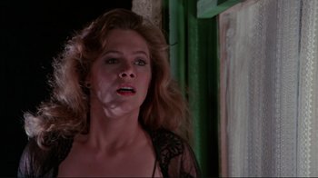 Movie still from “The Man with Two Brains” (1983), directed by Carl Reiner – A person with long hair; Close Up shot, Low angle