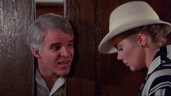 Movie still from “The Man with Two Brains” (1983), directed by Carl Reiner – A man and a woman talking to each other; Close Up shot, Over the shoulder angle