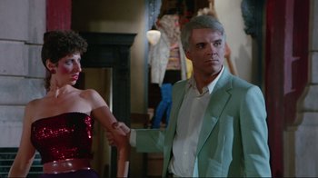 Movie still from “The Man with Two Brains” (1983), directed by Carl Reiner – A man and a woman holding each other's hands; Medium shot, Over the shoulder angle