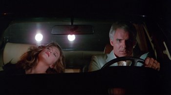 Movie still from “The Man with Two Brains” (1983), directed by Carl Reiner – A man and a woman in the back seat of a car; Medium shot, Low angle