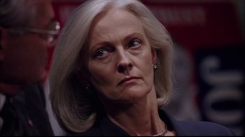Movie still from “The Manchurian Candidate” (2004), directed by Jonathan Demme – An older woman with white blonde hair looking at the camera; Close Up shot, Low angle