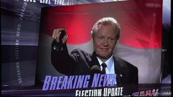 Movie still from “The Manchurian Candidate” (2004), directed by Jonathan Demme – An image of a man holding a microphone in front of a television screen; Close Up shot, Low angle