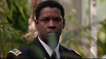 Movie still from “The Manchurian Candidate” (2004), directed by Jonathan Demme – A person wearing a suit and tie; Close Up shot, Over the shoulder angle