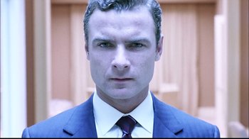 Movie still from “The Manchurian Candidate” (2004), directed by Jonathan Demme – A person wearing a suit and tie; Close Up shot, Low angle