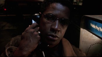 Movie still from “The Manchurian Candidate” (2004), directed by Jonathan Demme – A person talking on a phone; Close Up shot, High angle