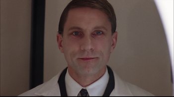 Movie still from “The Manchurian Candidate” (2004), directed by Jonathan Demme – A person wearing a white shirt and a tie; Close Up shot, Low angle