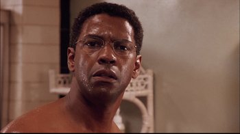 Movie still from “The Manchurian Candidate” (2004), directed by Jonathan Demme – A person wearing glasses; Close Up shot, Low angle