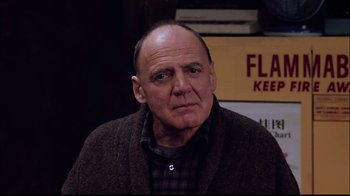 Movie still from “The Manchurian Candidate” (2004), directed by Jonathan Demme – An older man wearing a brown jacket and a plaid shirt; Close Up shot, Low angle