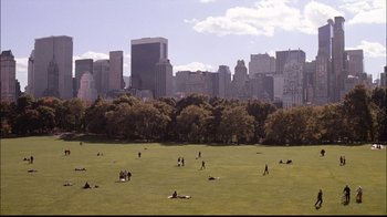 Movie still from “The Manchurian Candidate” (2004), directed by Jonathan Demme – A group of people in a field with a city skyline in the background; Extreme Wide shot, High angle