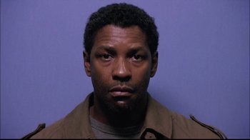 Movie still from “The Manchurian Candidate” (2004), directed by Jonathan Demme – A person wearing a brown jacket; Close Up shot, Low angle