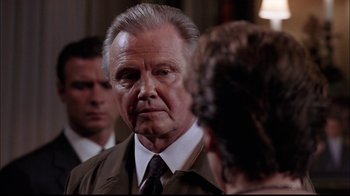 Movie still from “The Manchurian Candidate” (2004), directed by Jonathan Demme – An older man in a brown jacket and a woman in a brown jacket; Close Up shot, Over the shoulder angle