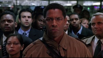 Movie still from “The Manchurian Candidate” (2004), directed by Jonathan Demme – A group of men standing in front of each other wearing glasses; Close Up shot, Low angle