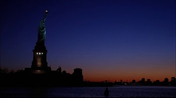 Movie still from “The Manchurian Candidate” (2004), directed by Jonathan Demme – The statue of liberty is lit up at night; Extreme Wide shot, Low angle