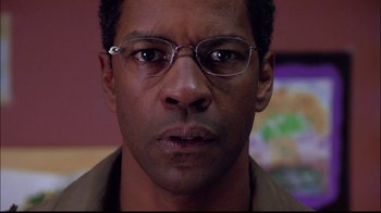 Movie still from “The Manchurian Candidate” (2004), directed by Jonathan Demme – Denzel washington wearing glasses; Close Up shot, Low angle