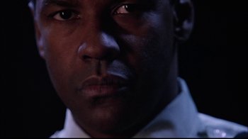 Movie still from “The Manchurian Candidate” (2004), directed by Jonathan Demme – A man's face in the dark; Close Up shot, Low angle