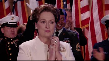 Movie still from “The Manchurian Candidate” (2004), directed by Jonathan Demme – A person wearing a suit and tie; Close Up shot, Over the shoulder angle